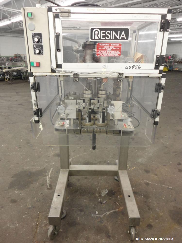 Used Resina Model RT-20 cap tightener retorquer. Capable of speeds up to 90 bottles per minute. Cap size range: 13mm to 38mm. C frame desing, has two sets of cap tightening wheel, single side belt gr...