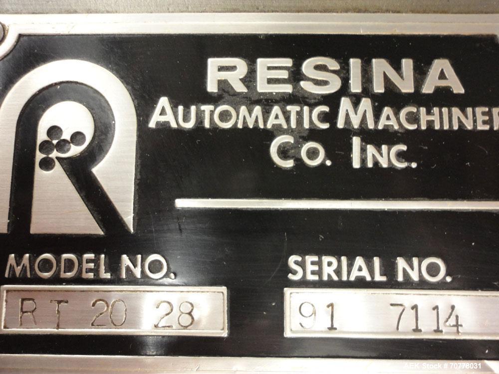Used Resina Model RT-20 cap tightener retorquer. Capable of speeds up to 90 bottles per minute. Cap size range: 13mm to 38mm. C frame desing, has two sets of cap tightening wheel, single side belt gr...