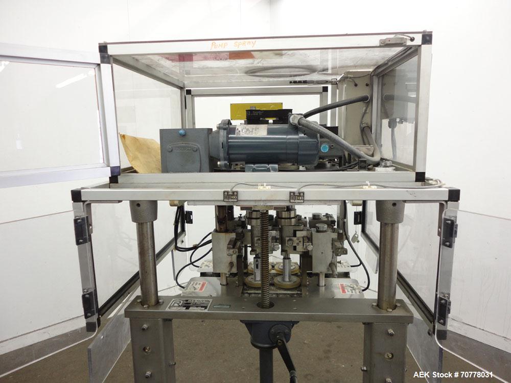 Used Resina Model RT-20 cap tightener retorquer. Capable of speeds up to 90 bottles per minute. Cap size range: 13mm to 38mm. C frame desing, has two sets of cap tightening wheel, single side belt gr...
