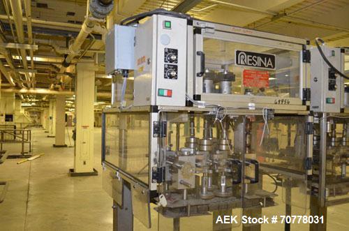 Used Resina Model RT-20 cap tightener retorquer. Capable of speeds up to 90 bottles per minute. Cap size range: 13mm to 38mm. C frame desing, has two sets of cap tightening wheel, single side belt gr...