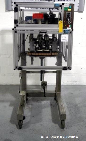 Used Resina Model RT20-53 Cap Tightener Retorquer. Capable of speeds up to 90 bottles per minute. Cap size range: 13mm to 38mm. C frame desing, has two sets of cap tightening wheel, single side belt ...