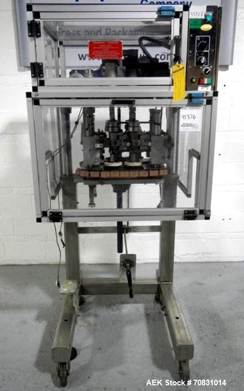 Used Resina Model RT20-53 Cap Tightener Retorquer. Capable of speeds up to 90 bottles per minute. Cap size range: 13mm to 38mm. C frame desing, has two sets of cap tightening wheel, single side belt ...