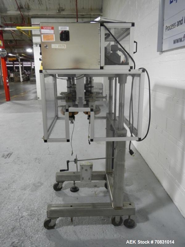 Used Resina Model RT20-53 Cap Tightener Retorquer. Capable of speeds up to 90 bottles per minute. Cap size range: 13mm to 38mm. C frame desing, has two sets of cap tightening wheel, single side belt ...