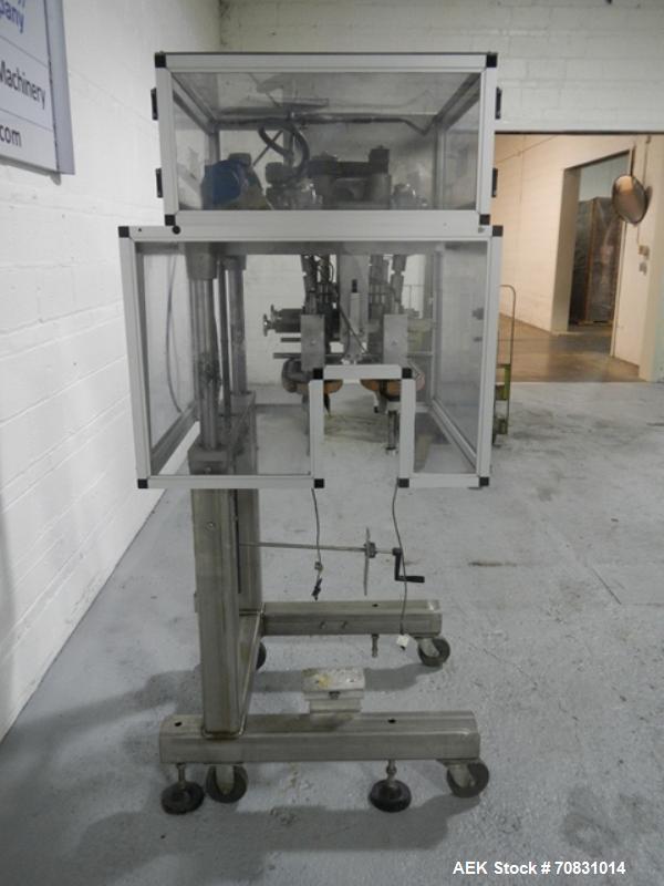Used Resina Model RT20-53 Cap Tightener Retorquer. Capable of speeds up to 90 bottles per minute. Cap size range: 13mm to 38mm. C frame desing, has two sets of cap tightening wheel, single side belt ...
