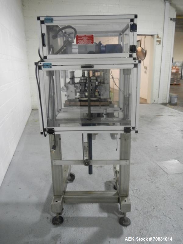 Used Resina Model RT20-53 Cap Tightener Retorquer. Capable of speeds up to 90 bottles per minute. Cap size range: 13mm to 38mm. C frame desing, has two sets of cap tightening wheel, single side belt ...