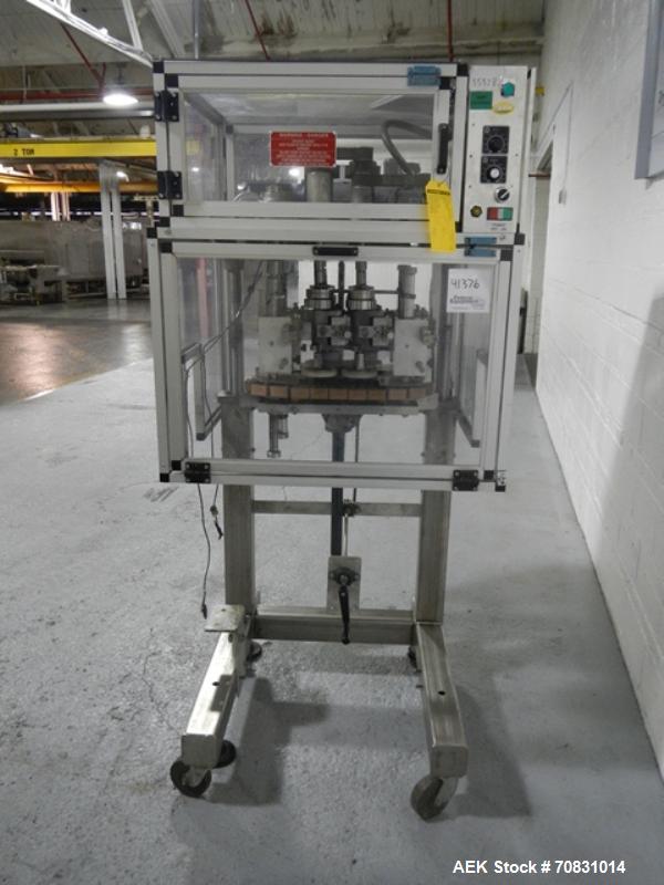Used Resina Model RT20-53 Cap Tightener Retorquer. Capable of speeds up to 90 bottles per minute. Cap size range: 13mm to 38mm. C frame desing, has two sets of cap tightening wheel, single side belt ...