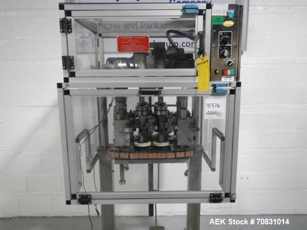 Used Resina Model RT20-53 Cap Tightener Retorquer. Capable of speeds up to 90 bottles per minute. Cap size range: 13mm to 38mm. C frame desing, has two sets of cap tightening wheel, single side belt ...