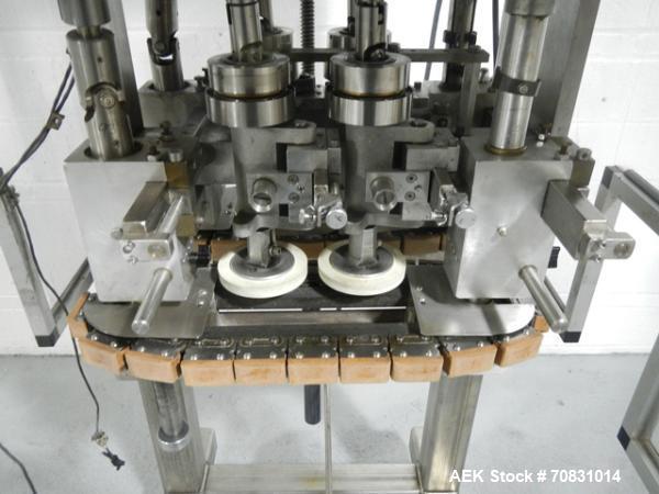 Used Resina Model RT20-53 Cap Tightener Retorquer. Capable of speeds up to 90 bottles per minute. Cap size range: 13mm to 38mm. C frame desing, has two sets of cap tightening wheel, single side belt ...
