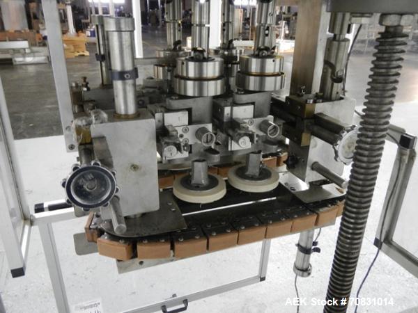 Used Resina Model RT20-53 Cap Tightener Retorquer. Capable of speeds up to 90 bottles per minute. Cap size range: 13mm to 38mm. C frame desing, has two sets of cap tightening wheel, single side belt ...