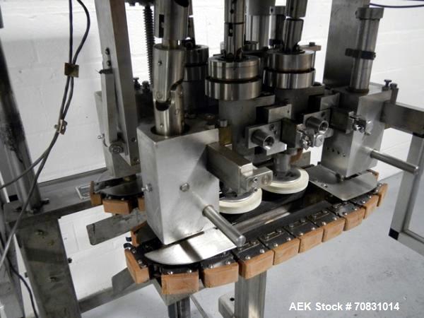 Used Resina Model RT20-53 Cap Tightener Retorquer. Capable of speeds up to 90 bottles per minute. Cap size range: 13mm to 38mm. C frame desing, has two sets of cap tightening wheel, single side belt ...