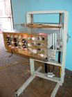 Used Elf model AC1600 (6) quill cap tightener. 3 sets of quills, last set of quills with mechanical clutch for torque application, 24 in long x 3/4 in single rubber bottle gripper belts, belt and gri...