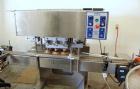 Used Acasi Model CS-5000 inline semi-automatic capper, cap tightener or retorquer. Has a cap size range: (Diam) 8mm to 100mm. Container Height: 1