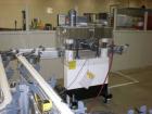 Used: Kaps-All model F4 inline quill cap tightener or retorquer capable of speeds over 150 BPM. Cap size range: 13 to 70mm. Has single belt side grippers, C frame design with painted base. Last used ...