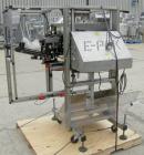 Used E-Pak (ELF) Semi Automatic Six Spindle Capper. (3) sets of (2) spindles. With cap chute feeder, cabable of speeds up to 120 CPM. Has C frame design to roll up to existing conveyor line. Cap size...