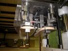 Used Kaps-All Model F4 Inline Quill Cap Tightener/Retorquer. Capable of speeds over 150 BPM. Cap size range: 13 to 70mm. Has single belt side grippers, C frame design with painted base. Last used in ...