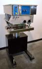 Used Filamatic (National Instruments) Model DL-4-CT 4 Quill Automatic Cap Tightening Machine. Capable of 80 containers per minute. (2) 2’’ Widex 19’’ long gripper belts, driven by a 1/2 hp, 90 volt D...