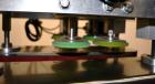 Used Filamatic (National Instruments) Model DL-4-CT 4 Quill Automatic Cap Tightening Machine. Capable of 80 containers per minute. (2) 2’’ Widex 19’’ long gripper belts, driven by a 1/2 hp, 90 volt D...