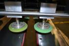 Used Filamatic (National Instruments) Model DL-4-CT 4 Quill Automatic Cap Tightening Machine. Capable of 80 containers per minute. (2) 2’’ Widex 19’’ long gripper belts, driven by a 1/2 hp, 90 volt D...