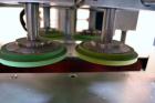 Used Filamatic (National Instruments) Model DL-4-CT 4 Quill Automatic Cap Tightening Machine. Capable of 80 containers per minute. (2) 2’’ Widex 19’’ long gripper belts, driven by a 1/2 hp, 90 volt D...