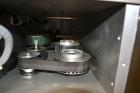 Used Filamatic (National Instruments) Model DL-4-CT 4 Quill Automatic Cap Tightening Machine. Capable of 80 containers per minute. (2) 2’’ Widex 19’’ long gripper belts, driven by a 1/2 hp, 90 volt D...