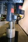 Used Filamatic (National Instruments) Model DL-4-CT 4 Quill Automatic Cap Tightening Machine. Capable of 80 containers per minute. (2) 2’’ Widex 19’’ long gripper belts, driven by a 1/2 hp, 90 volt D...