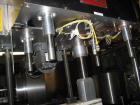 Used Kaps all Model BC Bottle Carrier/Transporter. 3/4 hp drive motor, serial #3812. Used for gap transporting between conveyors, depucking containers, bottom coding. Can handle vials to gallons with...