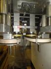Used Kaps-All Model F4 Inline Quill Cap Tightener or Retorquer capable of speeds over 150 BPM. Cap size range: 13 to 70 mm. Has single belt side grippers, C frame design with painted base. Last used ...
