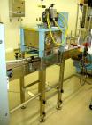 Used Newman Machinery Cap Tightener/Retorquer, Model 4CT. Capable of speeds up to 100 BPM. Cap size range from 13 to 100MM and a container range 13mm to 110mm diameter x 50 to 300mm high. Single side...
