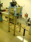 Used Newman Machinery Cap Tightener/Retorquer, Model 4CT. Capable of speeds up to 100 BPM. Cap size range from 13 to 100MM and a container range 13mm to 110mm diameter x 50 to 300mm high. Single side...