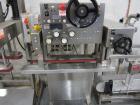 Used Kiss Packaging Model CT-04 Automatic Cap Tightener/Retorquer. Capable of speeds over 100 containers per minute. Has an adjustable cap size range from 13mm - 110mm. Has single belt grippers, hand...