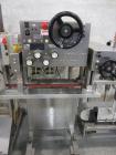 Used Kiss Packaging Model CT-04 Automatic Cap Tightener/Retorquer. Capable of speeds over 100 containers per minute. Has an adjustable cap size range from 13mm - 110mm. Has single belt grippers, hand...