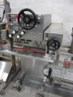 Used Kiss Packaging Model CT-04 Automatic Cap Tightener/Retorquer. Capable of speeds over 100 containers per minute. Has an adjustable cap size range from 13mm - 110mm. Has single belt grippers, hand...