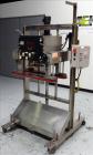 Used Kiss Packaging Model VCT-04 Automatic Cap Tightener/Retorquer. Capable of speeds over 100 containers per minute. Has an adjustable cap size range from 13mm - 110mm. Has 32