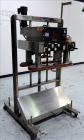 Used Kiss Packaging Model VCT-04 Automatic Cap Tightener/Retorquer. Capable of speeds over 100 containers per minute. Has an adjustable cap size range from 13mm - 110mm. Has 32