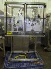 Used New England Machinery Cap Tightener and Retorquer, Model NEPMTE-1F-DB-2. Has dual cap tightening spindles. Single belt grippers. Cap size range:  12 mm to 100 mm or .5