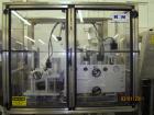Used New England Machinery Cap Tightener and Retorquer, Model NEPMTE-1F-DB-2. Has dual cap tightening spindles. Single belt grippers. Cap size range:  12 mm to 100 mm or .5