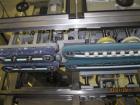 Used New England Machinery Cap Tightener and Retorquer, Model NEPMTE-1F-DB-2. Has dual cap tightening spindles. Single belt grippers. Cap size range:  12 mm to 100 mm or .5