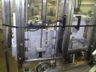 Used New England Machinery Cap Tightener and Retorquer, Model NEPMTE-1F-DB-2. Has dual cap tightening spindles. Single belt grippers. Cap size range:  12 mm to 100 mm or .5