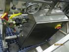 Used New England Machinery Cap Tightener and Retorquer, Model NEPMTE-1F-DB-2. Has dual cap tightening spindles. Single belt grippers. Cap size range:  12 mm to 100 mm or .5
