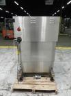 Used New Jersey Machine Model RTQ-150 Cap Tightener and Retorquer. Capable of speeds up to 300 bottles per minute. Stainless steel frame, mounts over existing conveyor. Has single side gripper belts....