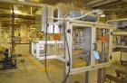 Used Resina Model RT-20 cap tightener retorquer. Capable of speeds up to 90 bottles per minute. Cap size range: 13mm t0 38mm. C frame desing, has two sets of cap tightening wheel, single side belt gr...