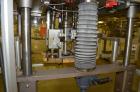 Used Resina Model RT-20 cap tightener retorquer. Capable of speeds up to 90 bottles per minute. Cap size range: 13mm t0 38mm. C frame desing, has two sets of cap tightening wheel, single side belt gr...