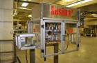 Used Resina Model RT-20 cap tightener retorquer. Capable of speeds up to 90 bottles per minute. Cap size range: 13mm t0 38mm. C frame desing, has two sets of cap tightening wheel, single side belt gr...