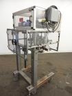 Used Resina Model RT-20 Cap Tightener Retorquer capable of speeds up to 90 bottles per minute. Cap size range: 13mm to 38mm. C frame design, has two sets of cap tightening wheels, single side belt gr...