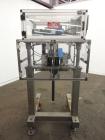 Used Resina Model RT-20 Cap Tightener Retorquer capable of speeds up to 90 bottles per minute. Cap size range: 13mm to 38mm. C frame design, has two sets of cap tightening wheels, single side belt gr...