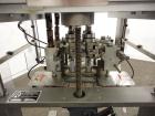 Used Resina Model RT-20 Cap Tightener Retorquer capable of speeds up to 90 bottles per minute. Cap size range: 13mm to 38mm. C frame design, has two sets of cap tightening wheels, single side belt gr...