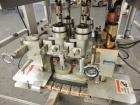 Used Resina Model RT-20 Cap Tightener Retorquer capable of speeds up to 90 bottles per minute. Cap size range: 13mm to 38mm. C frame design, has two sets of cap tightening wheels, single side belt gr...