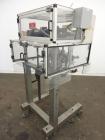Used Resina Model RT-20 cap tightener retorquer. Capable of speeds up to 90 bottles per minute. Cap size range: 13mm to 38mm. C frame desing, has two sets of cap tightening wheel, single side belt gr...