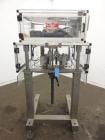 Used Resina Model RT-20 cap tightener retorquer. Capable of speeds up to 90 bottles per minute. Cap size range: 13mm to 38mm. C frame desing, has two sets of cap tightening wheel, single side belt gr...