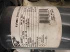 Used Resina Model RT-20 cap tightener retorquer. Capable of speeds up to 90 bottles per minute. Cap size range: 13mm to 38mm. C frame desing, has two sets of cap tightening wheel, single side belt gr...